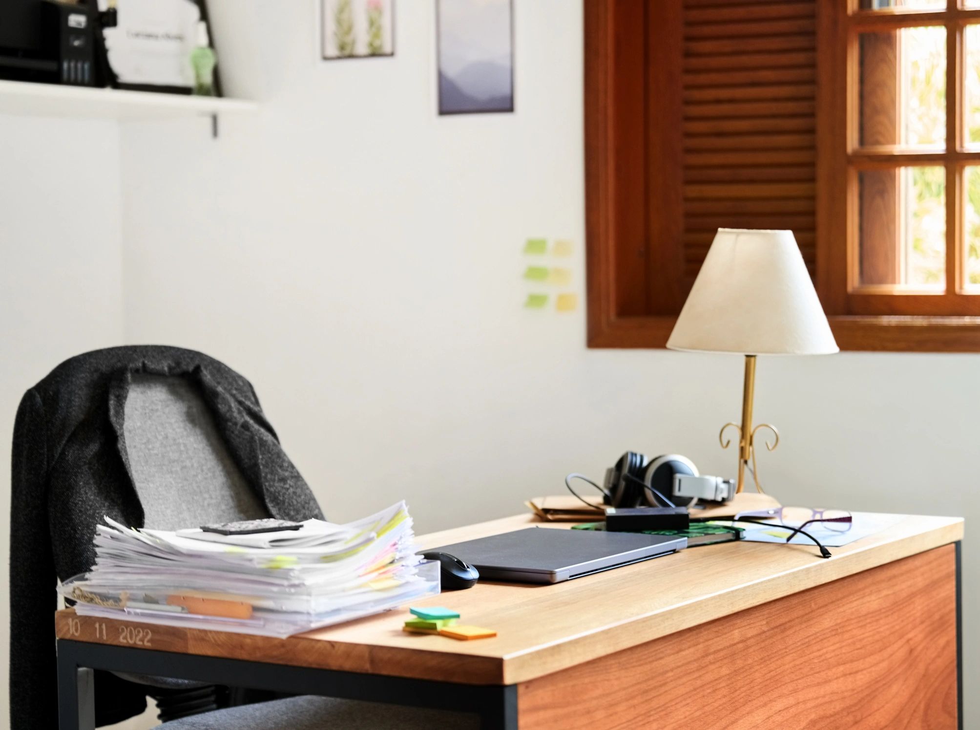 Office desk with laptop and documents