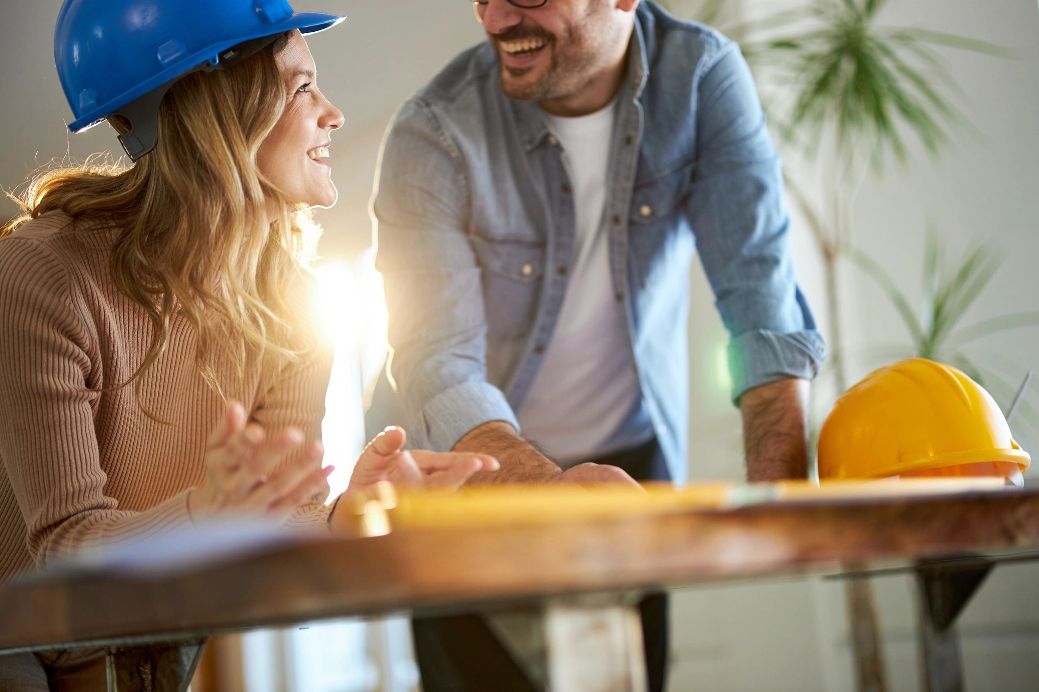Contractors reviewing blueprints together